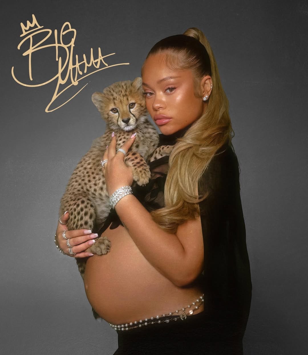 Latto holding a cheetah cub in the Big Mama visual